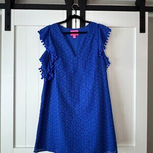 This is a Lilly Pulitzer Astara dress in Baja Blue Sand Dollar Eyelet lace.